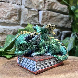 Daydreaming Baby Dragon On Book Ornament